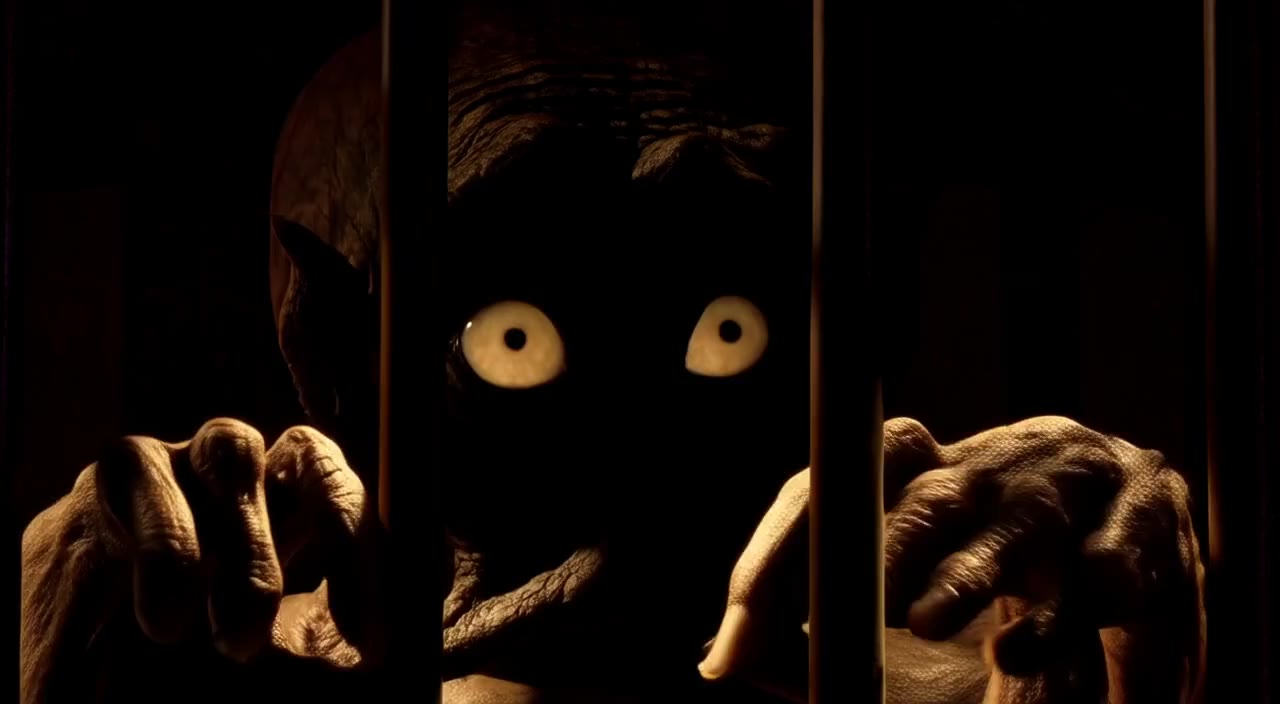 The first frame of a Wan 2.2 clip of Gollum in a cell: a dark, murky, barely-legible creature behind bars.