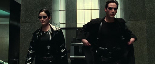 Neo reaches into his coat for his holstered guns.